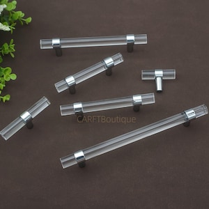 May include: A set of three ceramic mugs with a speckled, matte finish in cream, light grey, and dark grey. Each mug has a simple, minimalist design, suitable for coffee or tea.