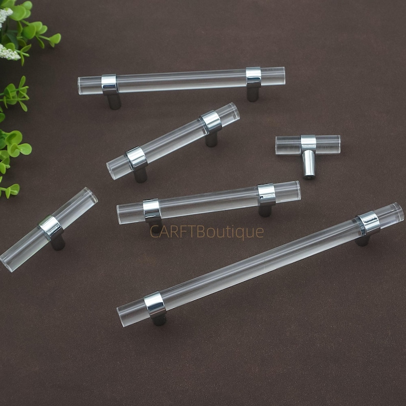 May include: A set of three ceramic mugs with a speckled, matte finish in cream, light grey, and dark grey. Each mug has a simple, minimalist design, suitable for coffee or tea.