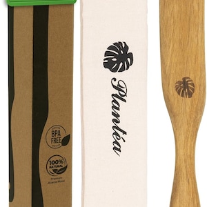 May include: A wooden spurtle set for sourdough baking. The set includes a wooden spurtle, a canvas bag with the Plantéa logo, and a cardboard box with the text "Premium Durable Wood". The spurtle is made of acacia wood.