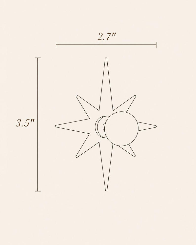 May include: A star-shaped wall hook with a circular knob center. The design features eight pointed rays of varying lengths. Dimension lines indicate a width of 2.7 inches and a height of 3.5 inches, providing clear scale for the object.
