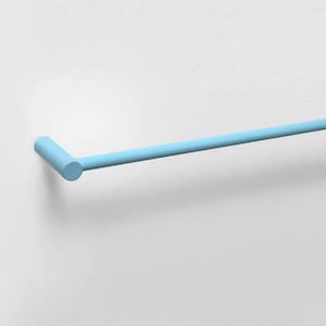 May include: A light blue towel bar featuring a cylindrical mounting bracket and a long, slender horizontal rod. The hardware has a smooth, matte finish and is attached to a plain, light-colored wall surface, extending outward to the right.