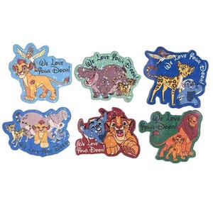 May include: A set of six die-cut stickers featuring animated animal characters from The Lion Guard. Each sticker displays colorful illustrations of lions, a hippo, a cheetah, and a honey badger with the text We Love Your Door! in a script font.