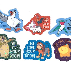 May include: A set of six holographic stickers featuring various animated characters, including a seagull, a pig with a rooster, a hummingbird, a crocodile, a dachshund, and a star. Each sticker includes the text WE LOVE YOUR DOOR! in blue, red, or purple.