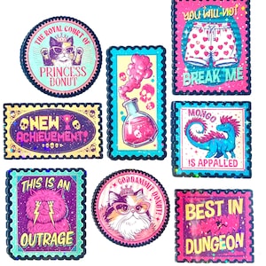 May include: A collection of eight rectangular and circular stickers with scalloped edges, featuring colorful illustrations of cats, a potion bottle, a dinosaur, and shorts, with text including Princess Donut, New Achievement, and Best in Dungeon.