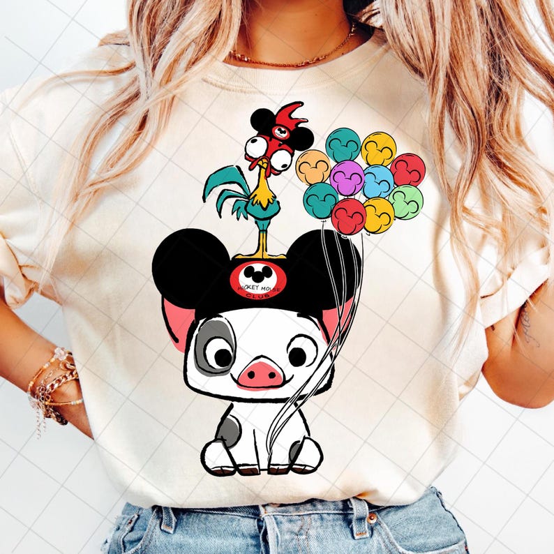 May include: Cream-colored t-shirt featuring a cartoon illustration of a pig wearing Mickey Mouse ears and holding colorful balloons. A rooster stands on top of the pig's head. The design includes the text "Mickey Mouse Club".