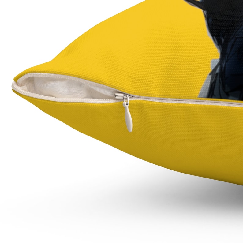 May include: A yellow throw pillow with a zipper closure. The pillow is made of a soft, comfortable fabric.