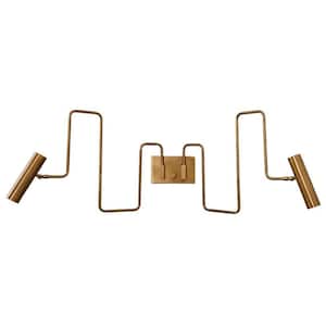 May include: A brass-toned wall sconce with a unique, zig-zag design. The fixture features two cylindrical light heads and a rectangular central plate with two switches. The overall design is minimalist and modern, suitable for various interior styles.