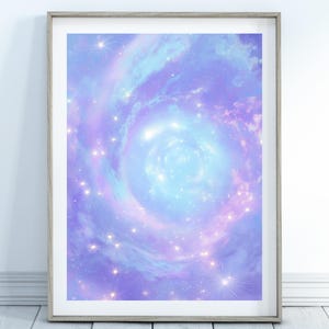 May include: A framed print depicting a swirling galaxy in blue, purple, and pink hues. The artwork showcases bright stars and a central, luminous vortex, evoking a celestial theme. The frame is a light wood colour.