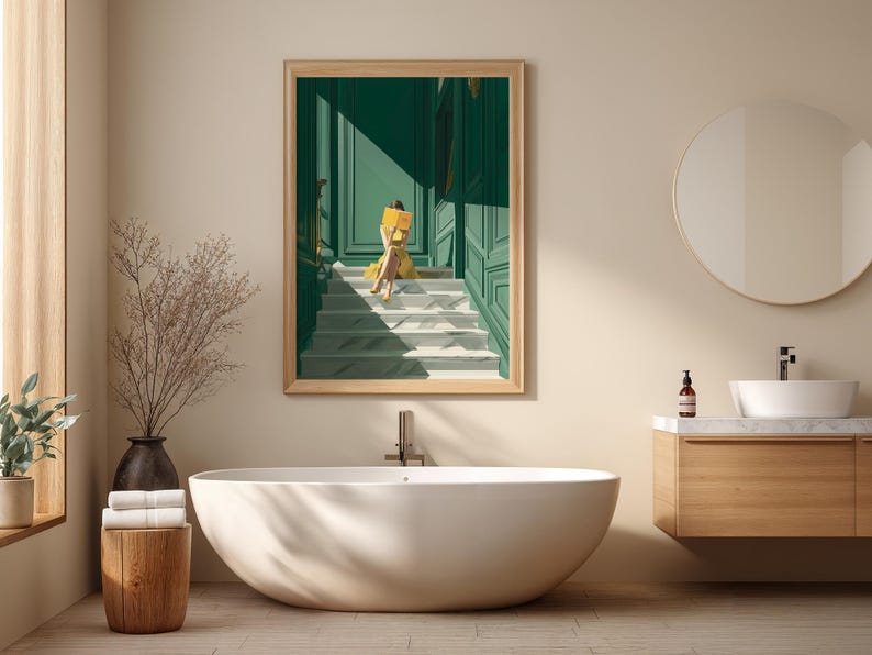 May include: A bathroom scene featuring a large, oval bathtub, a wooden vanity with a round mirror, and a framed artwork. The artwork depicts a person in yellow sitting on stairs. The walls are a neutral color, and the overall aesthetic is modern and minimalist.