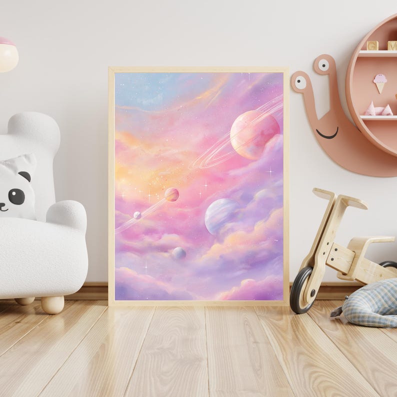 May include: A framed print featuring a dreamy space scene with pastel colors. The artwork depicts planets with rings, set against a backdrop of pink, purple, and blue clouds. Stars and celestial elements are scattered throughout the composition.