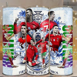 May include: A stainless steel tumbler featuring a collage of Cristiano Ronaldo in a red soccer uniform, set against a backdrop of blue and white floral patterns and the Portuguese Football Federation emblem. The tumbler has a straw and a lid.