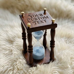 May include: A rustic wooden sign with the text "Welcome to our home" in white lettering. The sign features a distressed finish and a simple, inviting design, perfect for a front porch or entryway.