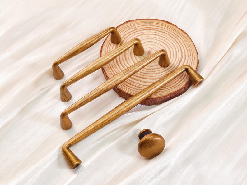 May include: A set of three ceramic mugs with a speckled, matte finish. The mugs are in shades of cream, light gray, and dark gray. Each mug has a simple, minimalist design, perfect for coffee or tea.