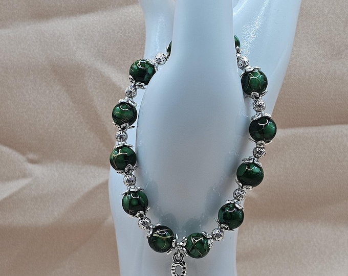 Featured listing image: Emerald Green Swirl Glass Bead Stretch Bracelet, Silver Snake and Heart Charm, Gothic Serpent Jewelry, Whimsigoth Gift
