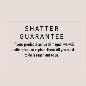 Peut inclure: Texte "SHATTER GUARANTEE" sur fond beige clair. Le texte en dessous indique : "Si vos produits arrivent endommag&eacute;s, nous les rembourserons ou les remplacerons avec plaisir. Il vous suffit de nous contacter."