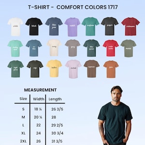May include: A display of Comfort Colors 1717 t-shirts in various colors, including white, black, and blue jean. The image also shows a measurement chart with sizes ranging from S to 2XL, with widths from 18 1/4 to 26 inches and lengths from 26 3/5 to 31 3/5 inches.