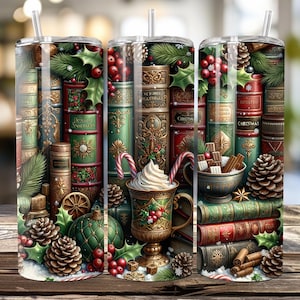 May include: A stainless steel tumbler with a festive Christmas design. The tumbler features a stack of vintage books, holly, pinecones, and a cup of hot chocolate with whipped cream. The design is in shades of green, red, and gold.