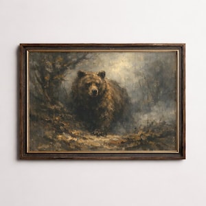 Op de afbeelding: Een ingelijst olieverfschilderij toont een bruine beer in een bosrijke omgeving. De beer is het middelpunt, met gedetailleerde vacht en een gerichte blik. Het kunstwerk gebruikt een gedempte kleurenpalet van bruin, groen en grijs.