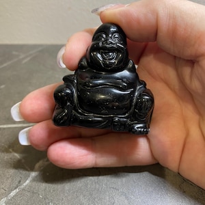 Buddha in natural obsidian stone