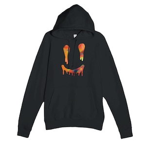 May include: Black hooded sweatshirt featuring a colourful, dripping smiley face design. The graphic includes orange, yellow, red, and blue paint drips, creating a vibrant aesthetic. The sweatshirt has a front pocket and a hood.