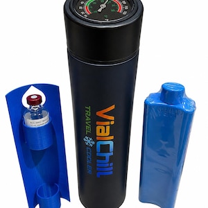 May include: A dark blue cylindrical travel cooler with a black lid featuring an integrated analog thermometer. The cooler is labeled VialChill and includes a blue plastic vial holder containing a glass vial and a separate blue rectangular ice pack.
