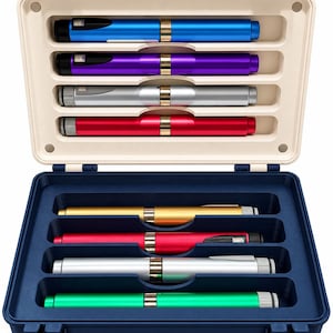 May include: A rectangular storage case with a cream-colored top section and a dark blue bottom section, each containing four horizontal slots. Inside are eight cylindrical pens in various metallic colors including blue, purple, silver, red, gold, and green.