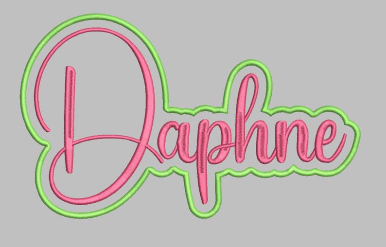 May include: Embroidered design of the name "Daphne" in a cursive font. The name is in pink with a green outline, set against a gray background. The design is likely for a personalized item.