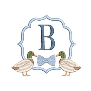 May include: Embroidered design featuring two ducks flanking a light blue bow tie. A light blue frame surrounds a large letter "B". The ducks have green heads, orange beaks, and tan and white bodies. The design is on a white background.