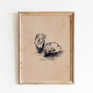 May include: A framed print featuring two detailed black and white illustrations of oysters. The artwork is set against a tan background, with a distressed, gold-toned frame. The style is reminiscent of vintage botanical or scientific illustrations.