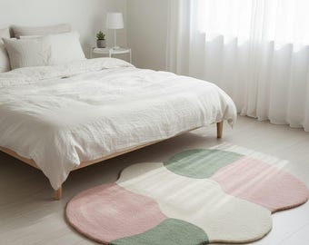 Pastelroze en groen abstract vloerkleed: zacht Scandinavisch decor