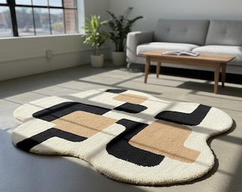 Modern abstract vloerkleed met onregelmatige vorm zwart en beige geometrisch patroon