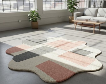 Modern abstract vloerkleed met onregelmatige vorm roze, grijs en ivoor geometrisch patroon