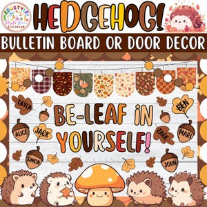 May include: A colorful bulletin board or door decor featuring the word "HEDGEHOG!" in autumn colors. The design includes a banner, leaves, acorns, and cartoon hedgehogs. The text "BE-LEAF IN YOURSELF!" is prominently displayed.