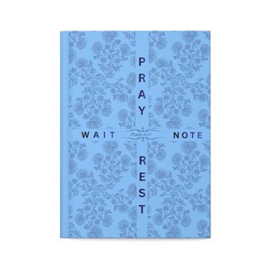 May include: A light blue journal with a floral pattern and the words "PRAY, WAIT, REST, NOTE" vertically. The journal has a matching blue spine and a ribbon with the text "Psalm 46:10".