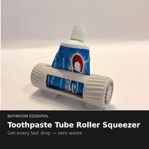 May include: A gray toothpaste tube roller squeezer with a blue and white tube of toothpaste. The toothpaste tube is partially inserted into the roller. The text "Toothpaste Tube Roller Squeezer" is visible.