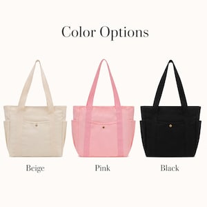 May include: Three tote bags in beige, pink, and black. Each bag has two side pockets, a front pocket with a gold button, and matching handles. The text "Color Options" is above the bags, with the color names below.