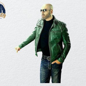 May include: A green leather jacket with a quilted shoulder design. The jacket has a zipper closure and a black collar. The model is wearing blue jeans and sunglasses. The logo "Quality One Jackets" is in the upper left corner.