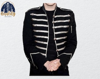 May include: Black military-style jacket with silver-colored trim and buttons. The jacket features multiple horizontal stripes across the chest and sleeves. The jacket has a high collar and decorative shoulder accents. The logo "Quality One Jackets" is in the upper left corner.