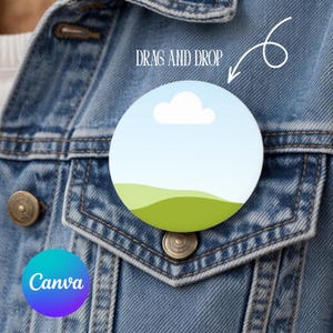 May include: A circular badge featuring a landscape design of a blue sky, white cloud, and green hills. The badge is attached to a denim jacket. The text "DRAG AND DROP" is above the badge, and the Canva logo is in the lower left.