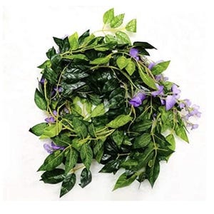 May include: A garland of artificial greenery with dark green leaves and small clusters of purple flowers. The leaves vary in shades of green, creating a realistic appearance. The garland is designed for decorative purposes.