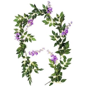 May include: Artificial wisteria garland featuring vibrant purple flowers and lush green leaves. This decorative garland is ideal for adding a touch of nature to any space, perfect for weddings, parties, or home decor.