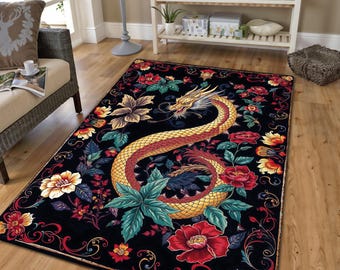 May include: A rectangular black rug featuring a golden dragon design with red and yellow accents. The dragon is surrounded by colorful flowers and foliage. The rug has a decorative border and the word "KIRAC" is printed at the bottom.
