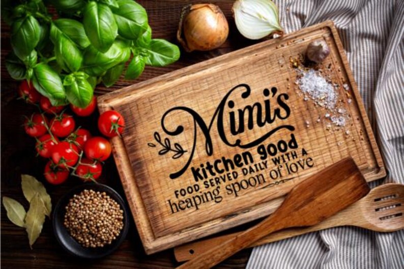 May include: A wooden cutting board with the text "Mimi's kitchen good" and other text. The board is surrounded by fresh basil, tomatoes, onions, spices, and wooden utensils. A rustic, homey kitchen theme.