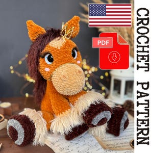 May include: A handmade, plush horse toy in shades of brown, tan, and cream. The horse has a golden crown, long eyelashes, and a fluffy mane and tail. The image includes a PDF download icon and the text "CROCHET PATTERN".
