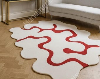 Alfombra abstracta de lujo en blanco y rojo, alfombra moderna irregular tejida a mano, alfombra de diseño artístico para una decoración impactante en la sala de estar.