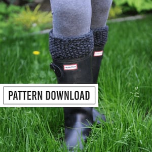 May include: Black rain boots with a red and white logo, paired with gray leggings and dark gray knitted boot cuffs. The boots are set against a backdrop of green grass. The text "PATTERN DOWNLOAD" is displayed.