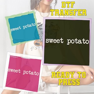 May include: DTF transfer designs with the text "sweet potato" in white on blue, pink, and black backgrounds. The words "READY TO PRESS" are in yellow block letters. The image is of a person wearing a t-shirt with a pumpkin graphic.