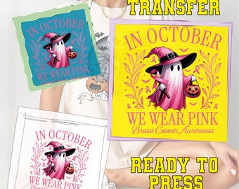 May include: DTF transfer designs with the text "In October We Wear Pink" and a ghost wearing a witch hat, holding a pink ribbon and a jack-o'-lantern. The design is for Breast Cancer Awareness.