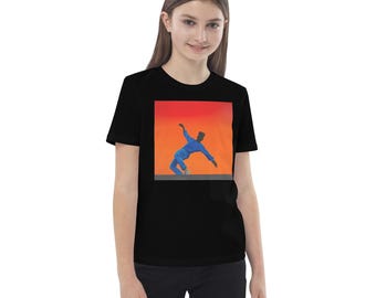 May include: Black t-shirt featuring a square graphic of a person in blue clothing against an orange and red gradient background. The person is in a dynamic pose. The shirt is made of a soft material.
