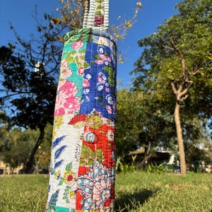 May include: A set of three ceramic mugs with a speckled, matte finish. The mugs are in shades of cream, light gray, and dark gray. Each mug has a simple, minimalist design, suitable for coffee or tea.